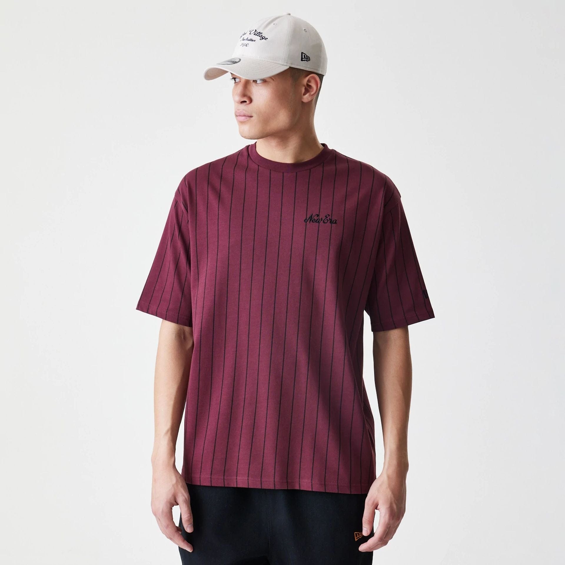 The Male model is wearing New Era Pinstripe Dark Red Oversized T-Shirt 1