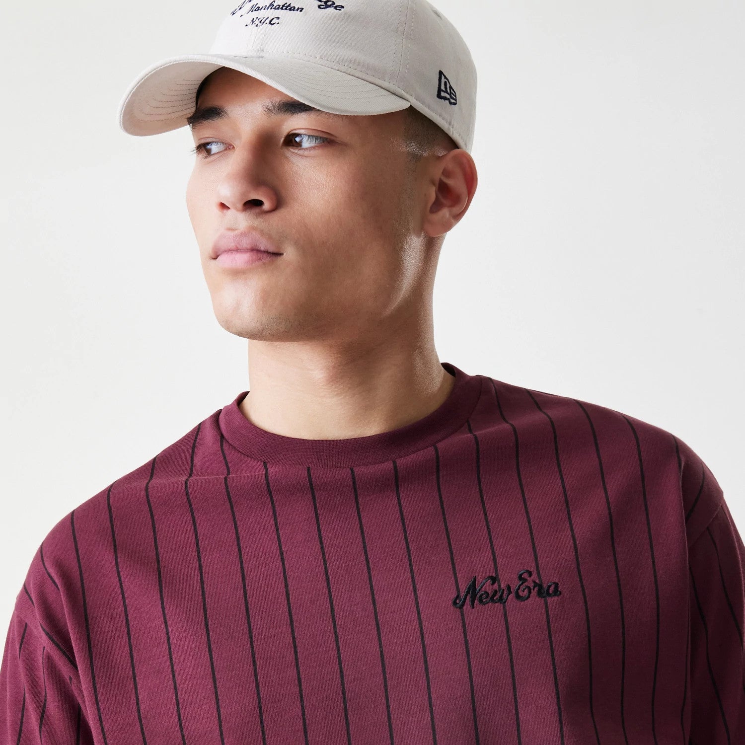 The Male model is wearing New Era Pinstripe Dark Red Oversized T-Shirt 4
