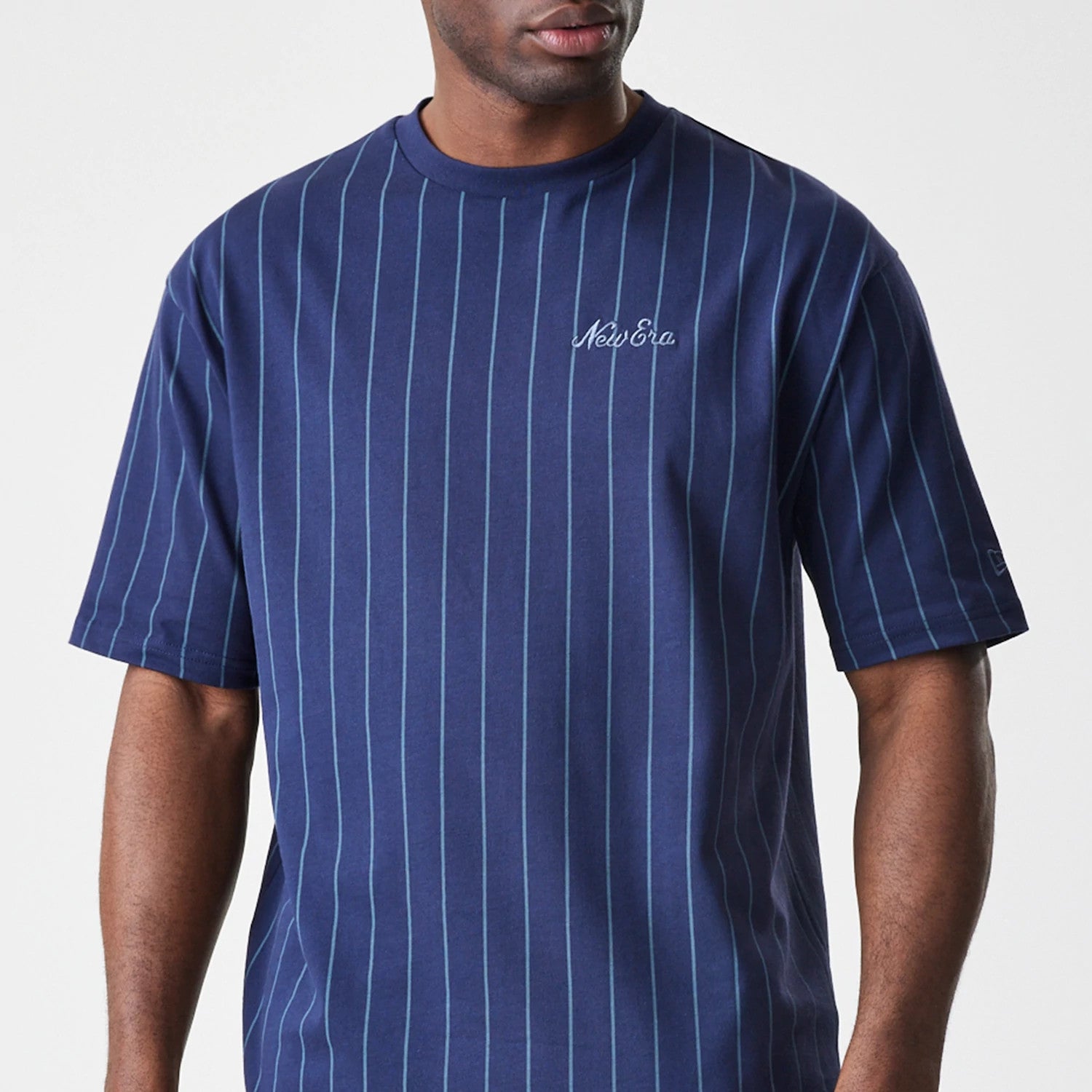 The Male model is wearing New Era Pinstripe Navy Oversized T-Shirt 3