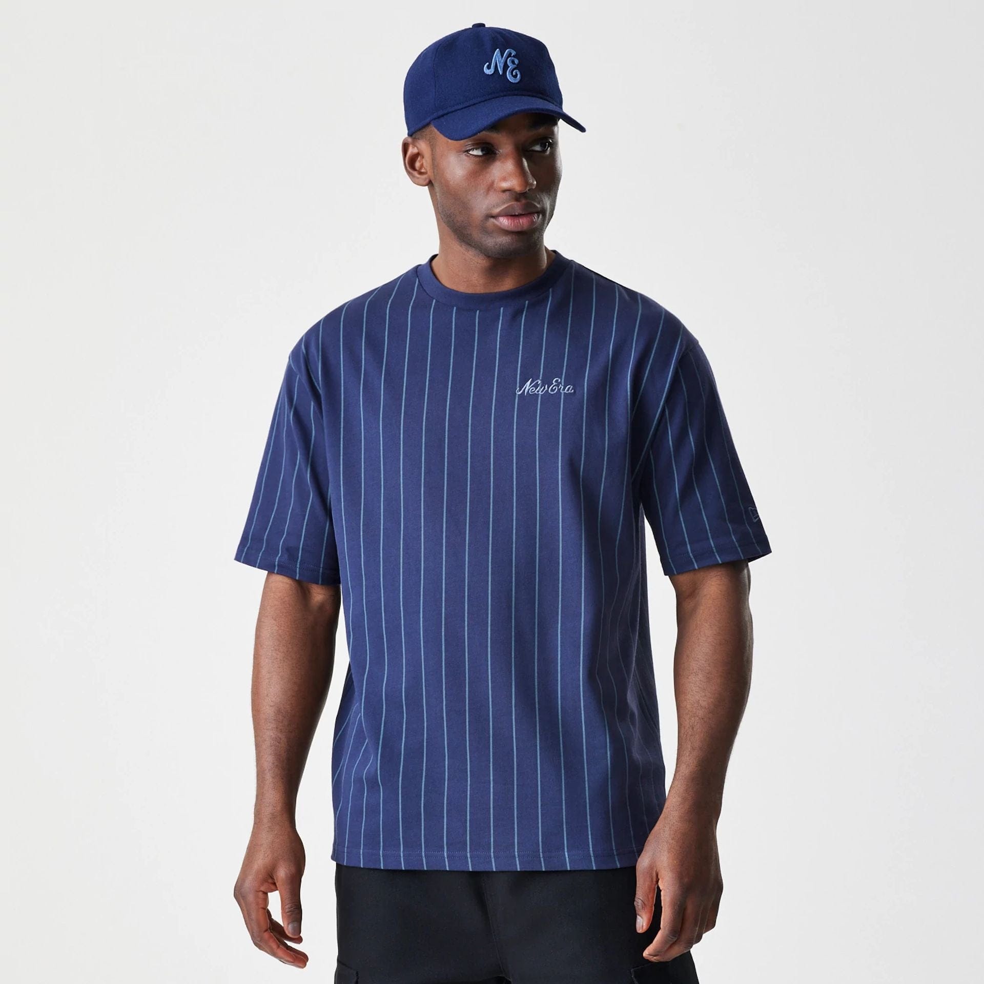 The Male model is wearing New Era Pinstripe Navy Oversized T-Shirt 1