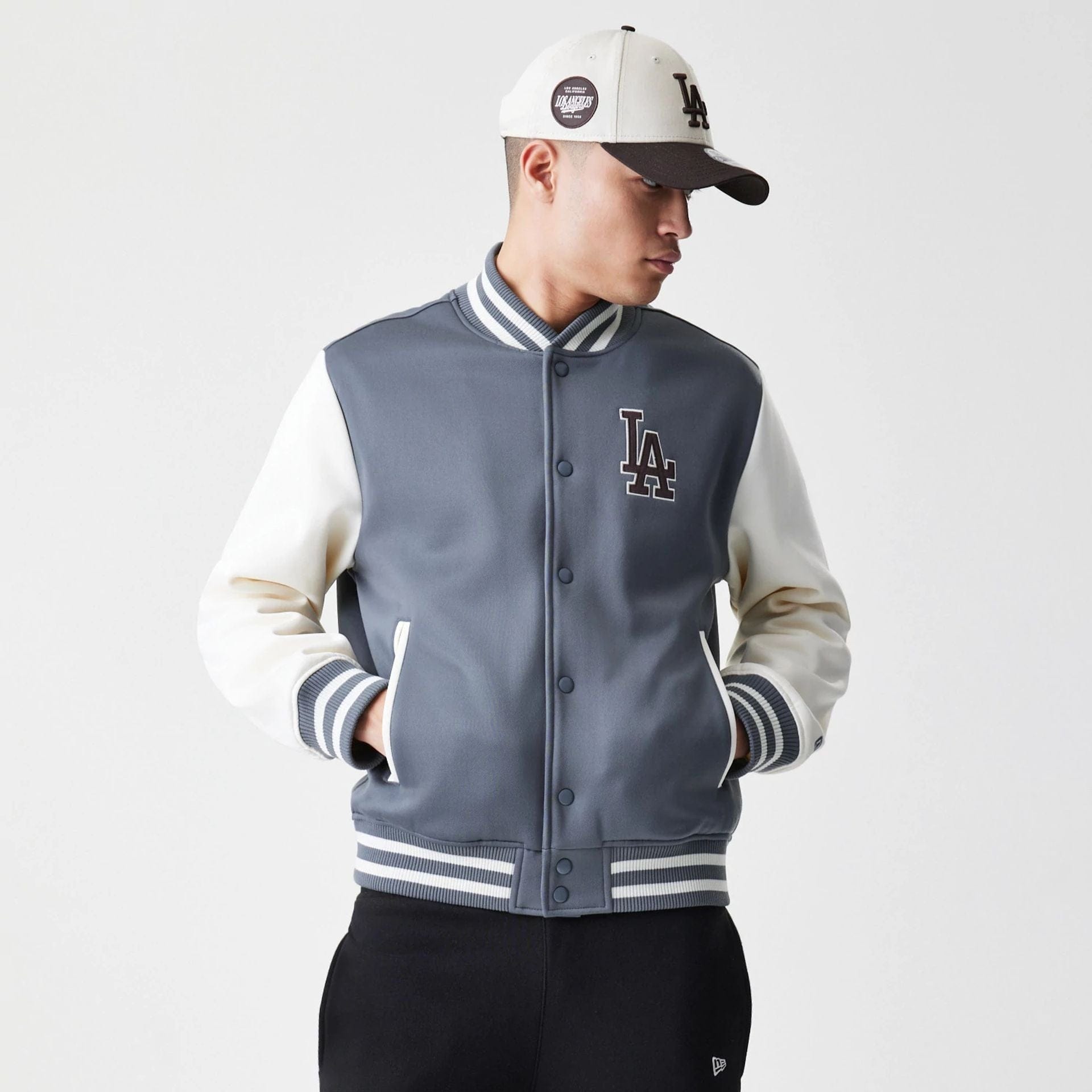 The Male model is wearing LA Dodgers MLB Dark Grey Varsity Jacket 1