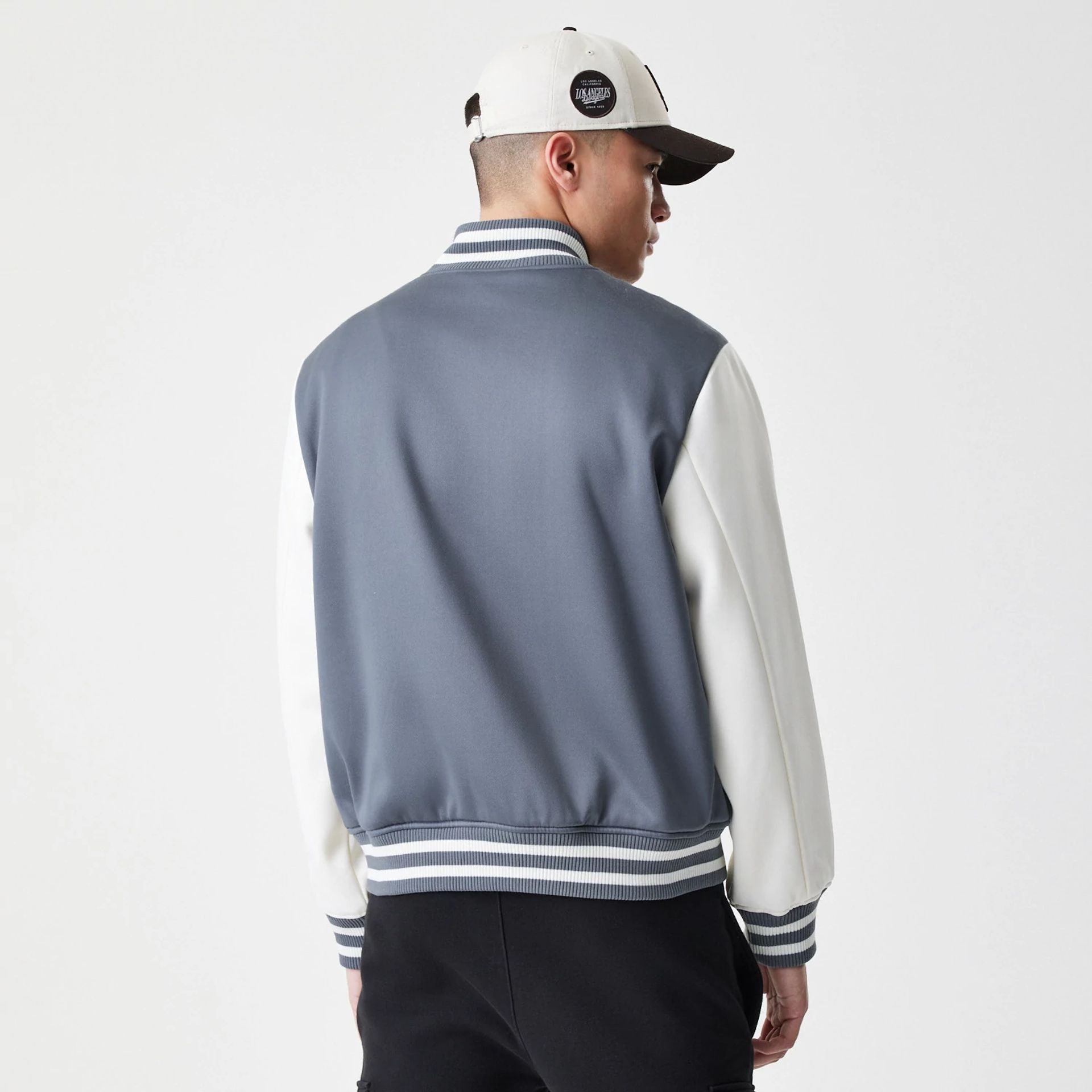 The Male model is wearing LA Dodgers MLB Dark Grey Varsity Jacket 2