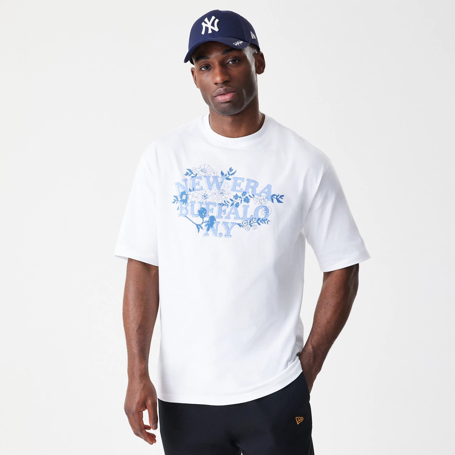 The Male model is wearing New Era Floral White Oversized T-Shirt 3