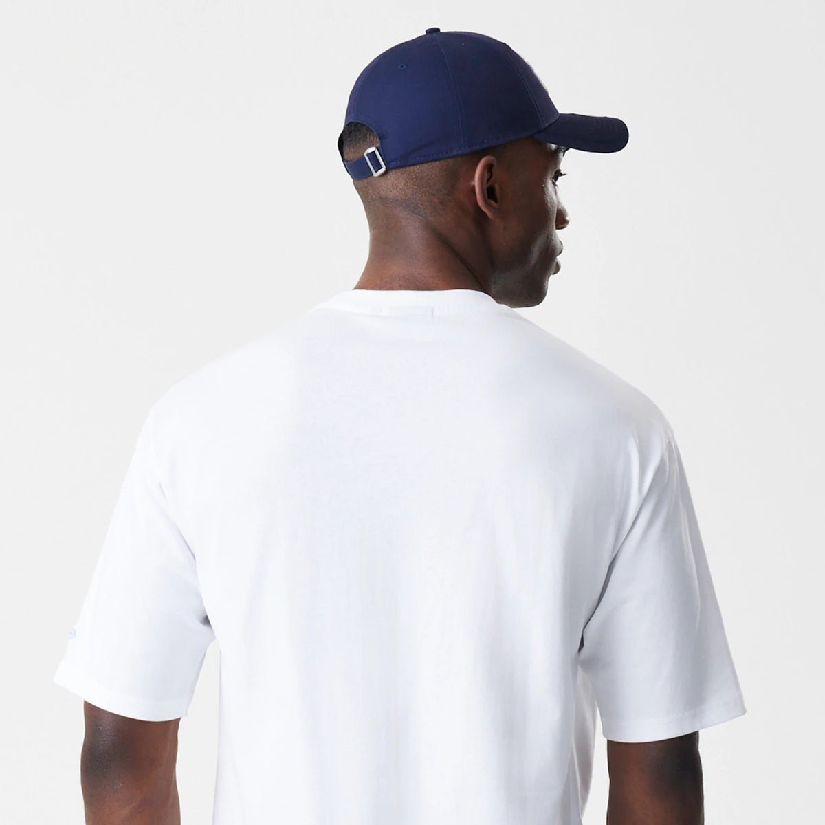 The Male model is wearing New Era Floral White Oversized T-Shirt 8