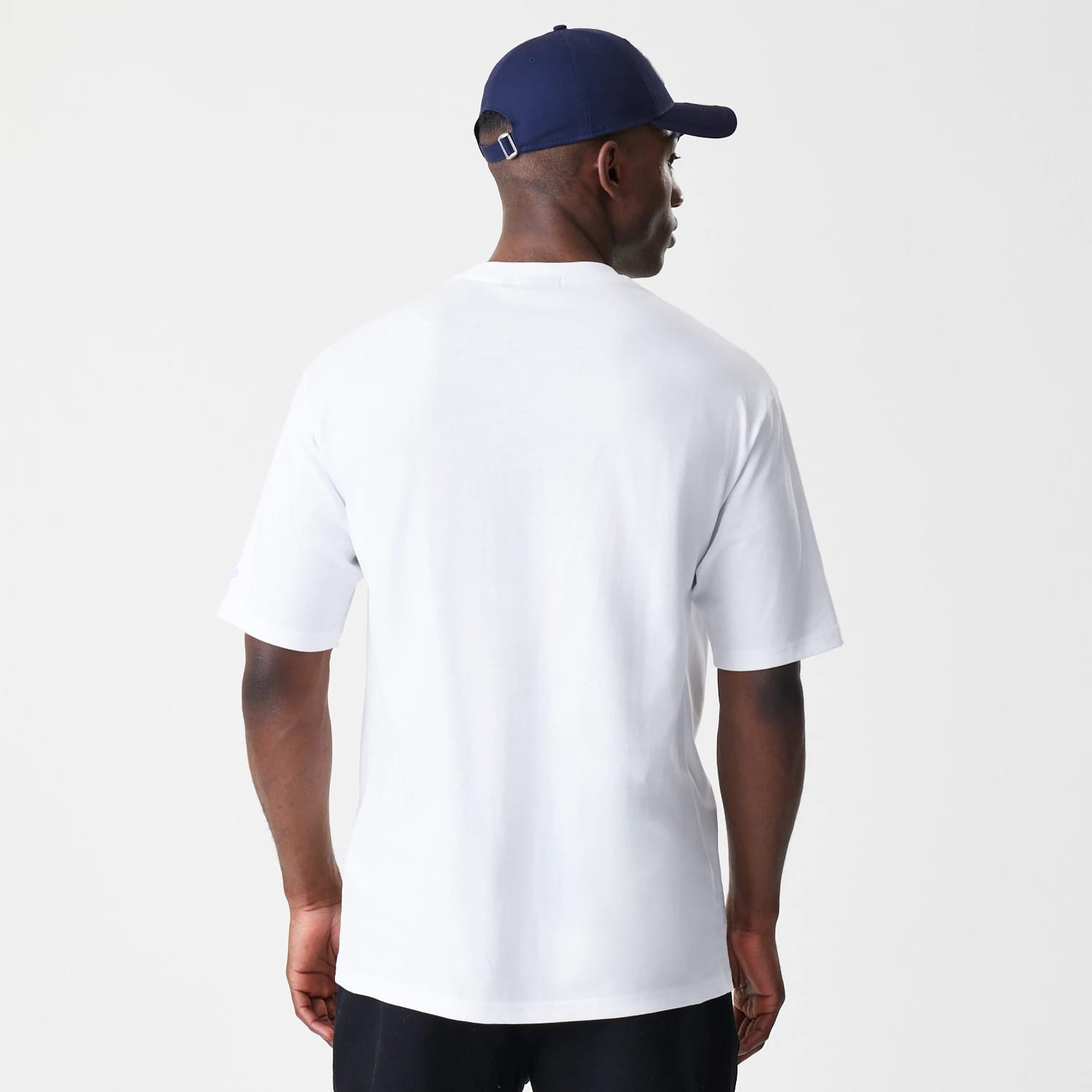The Male model is wearing New Era Floral White Oversized T-Shirt 2