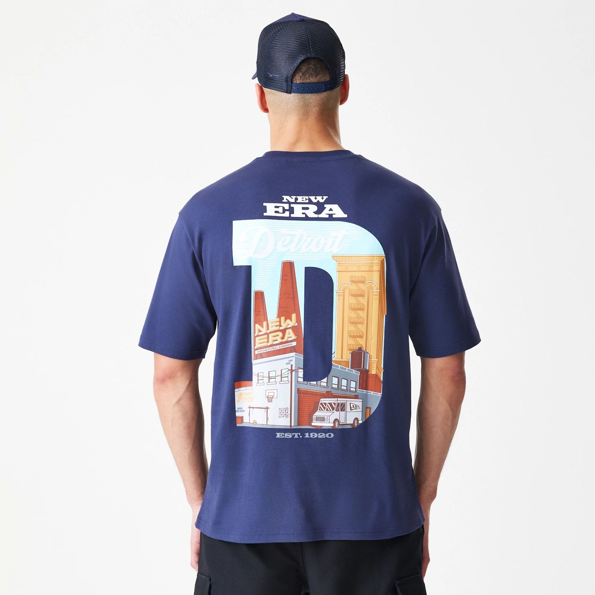 The Male model is wearing New Era Location Navy Oversized T-Shirt 2