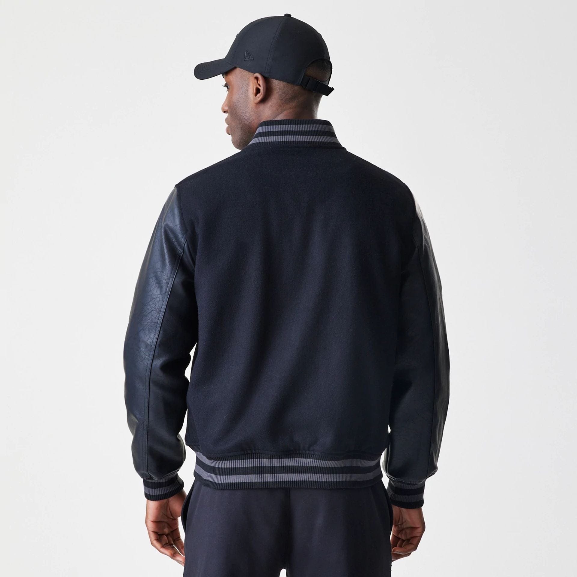 The Male model is wearing Chicago Bulls NBA Tonal Black Varsity Jacket 2