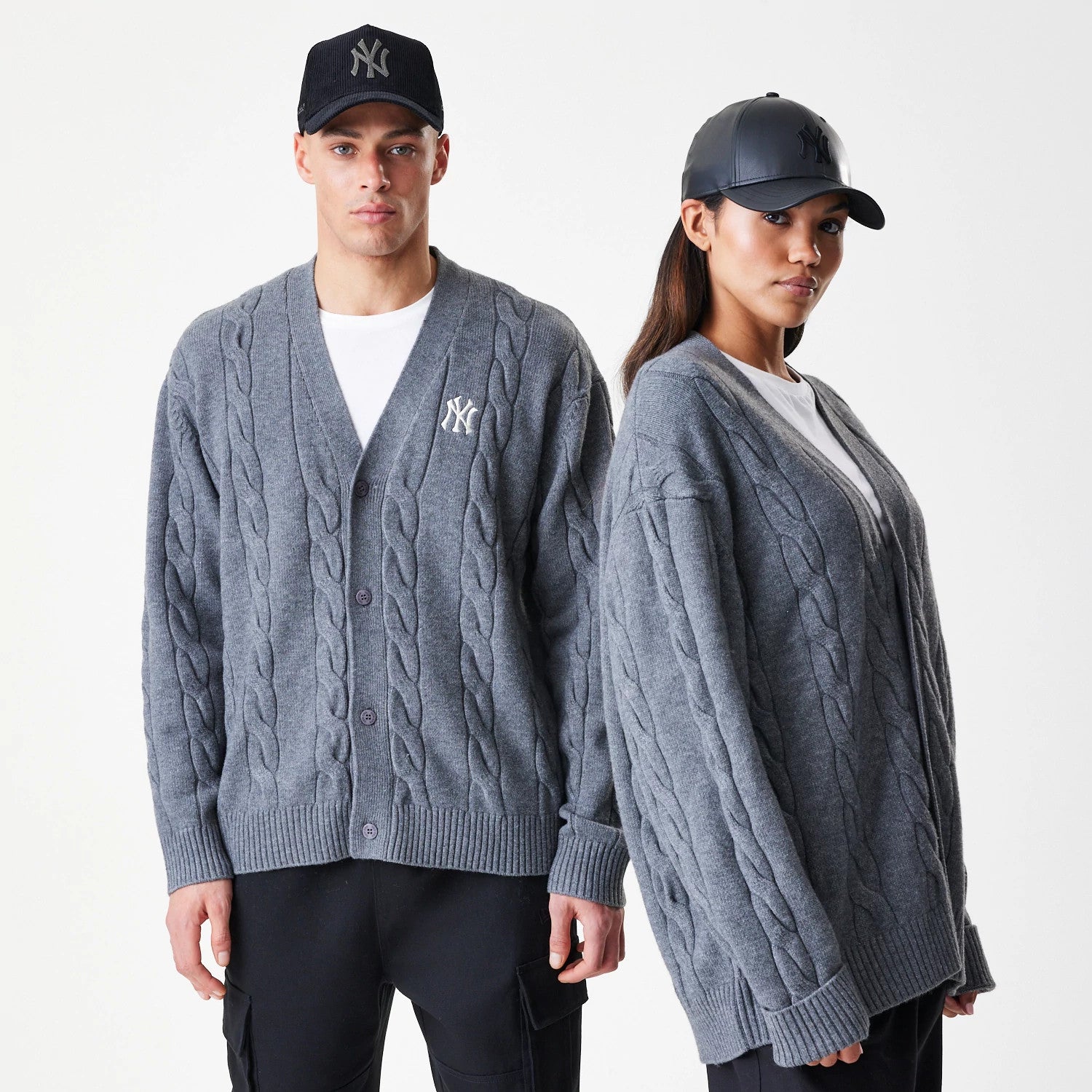 The Male model is wearing New York Yankees MLB Cable Knit Dark Grey Cardigan 1