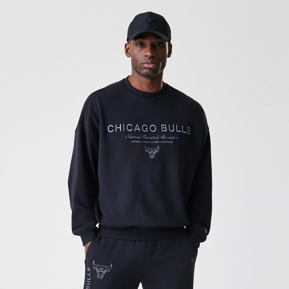 The Male model is wearing Chicago Bulls NBA Linear Black Crew Neck Sweater 3