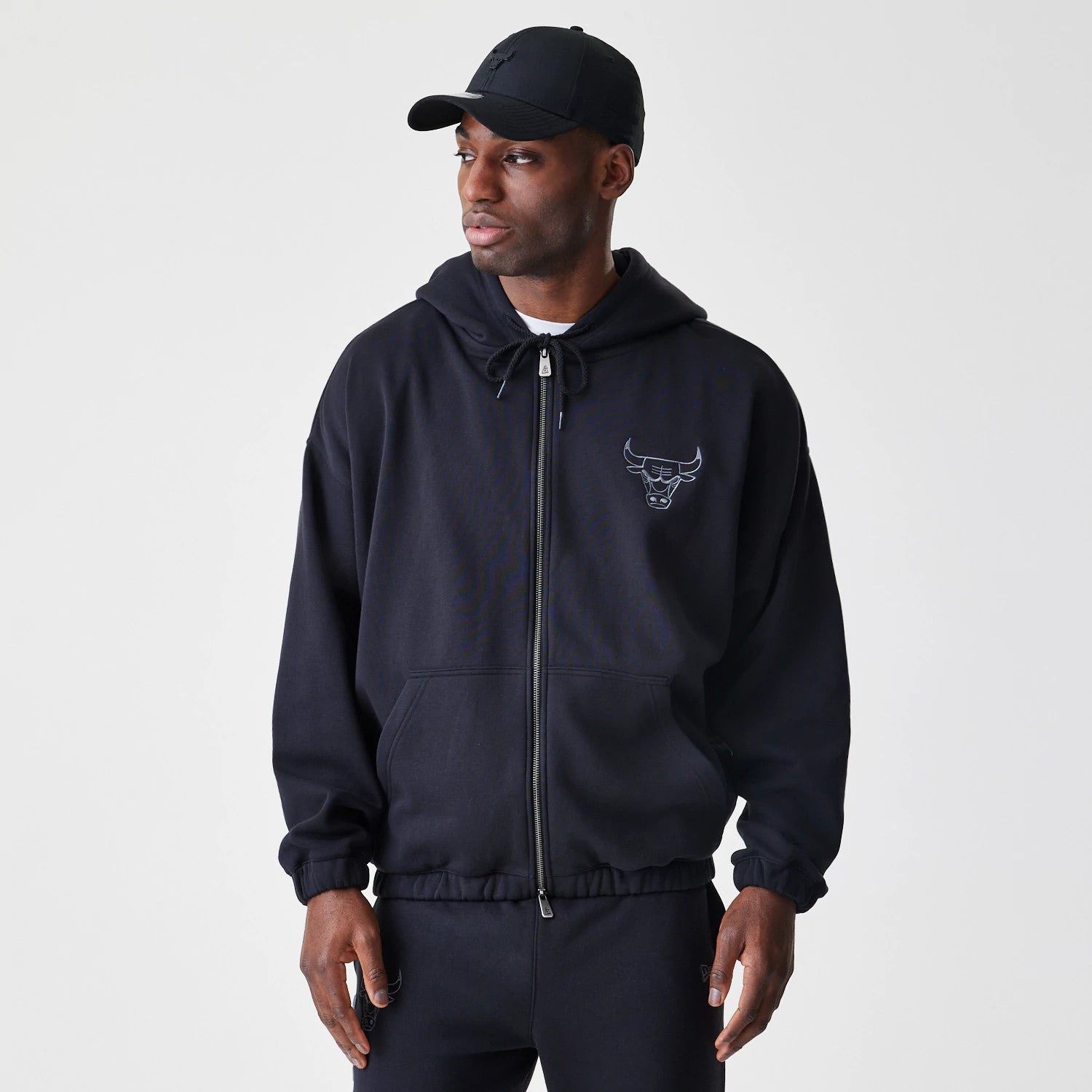 The Male model is wearing Chicago Bulls NBA Linear Black Oversized Full Zip Hoodie 1