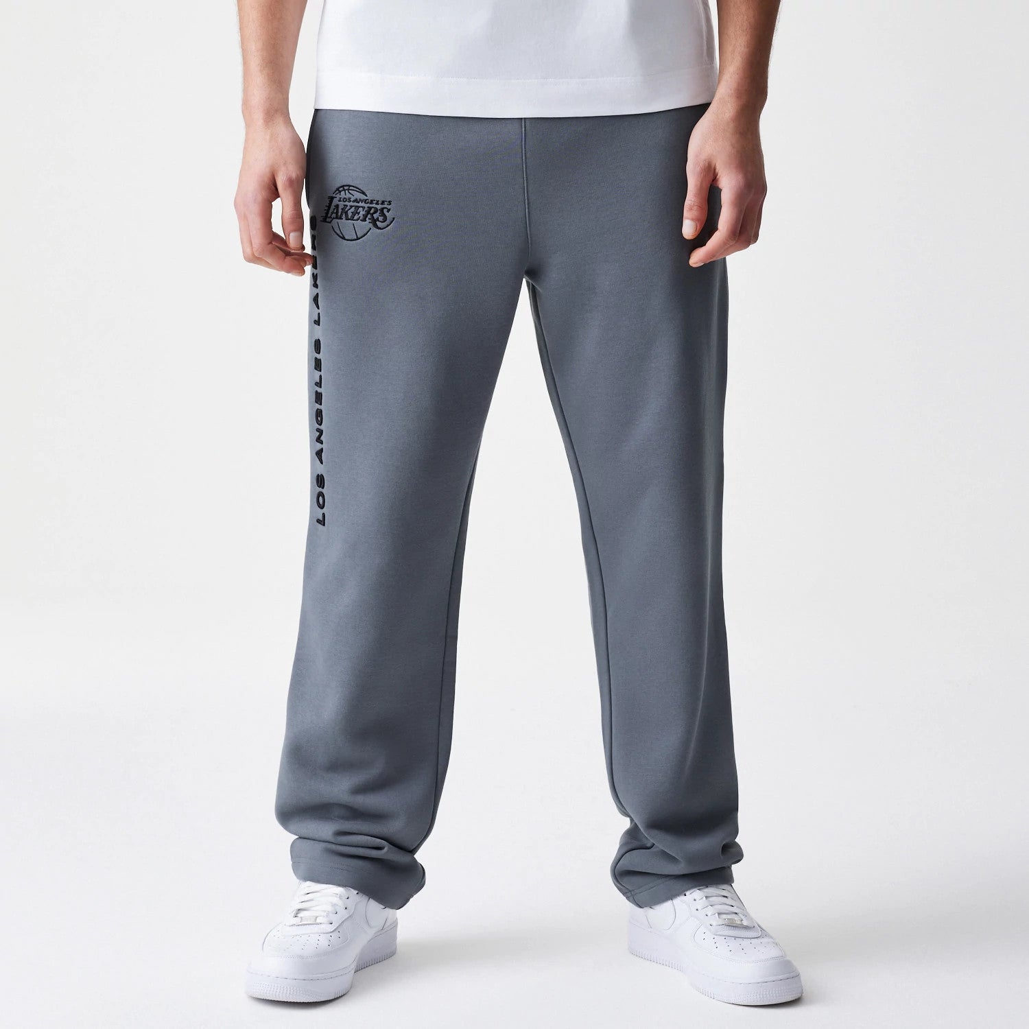 The Male model is wearing LA Lakers NBA Linear Dark Grey Straight Leg Joggers 1