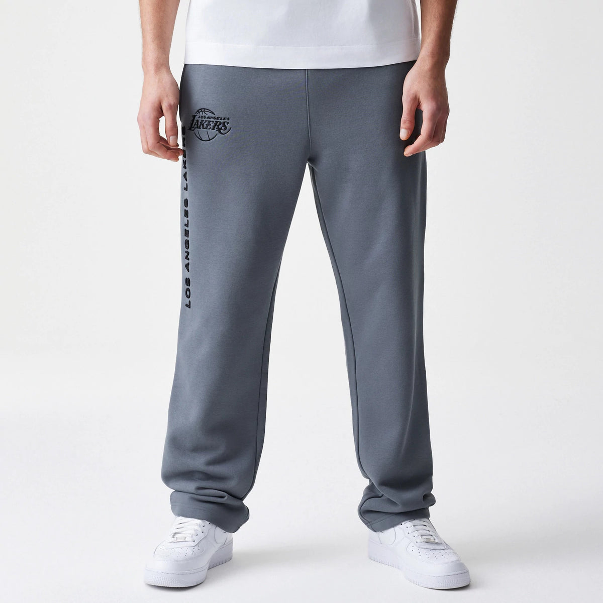 The Male model is wearing LA Lakers NBA Linear Dark Grey Straight Leg Joggers 1