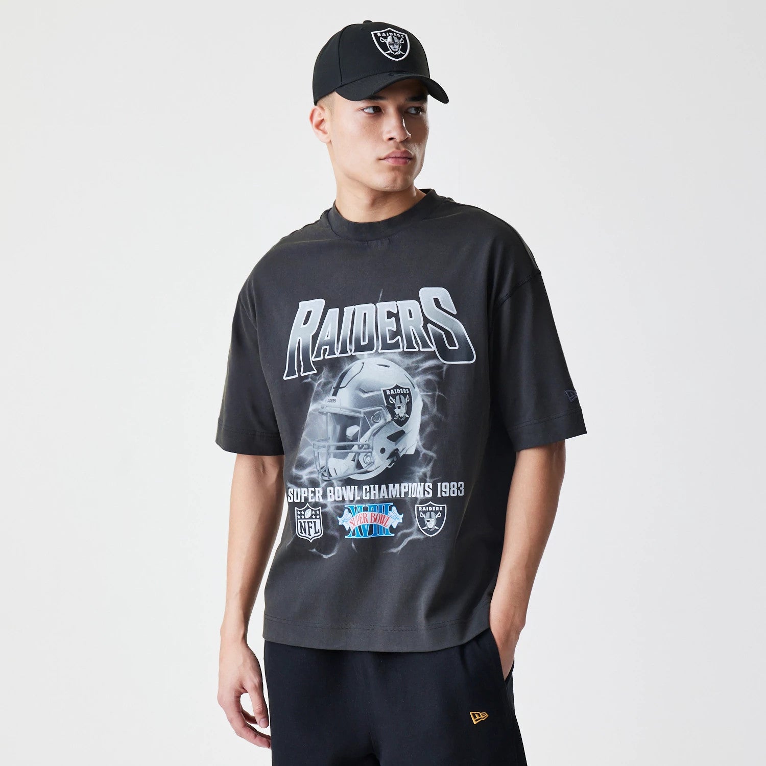 The Male model is wearing Las Vegas Raiders NFL Washed Boxy Dark Grey Oversized T-Shirt 1