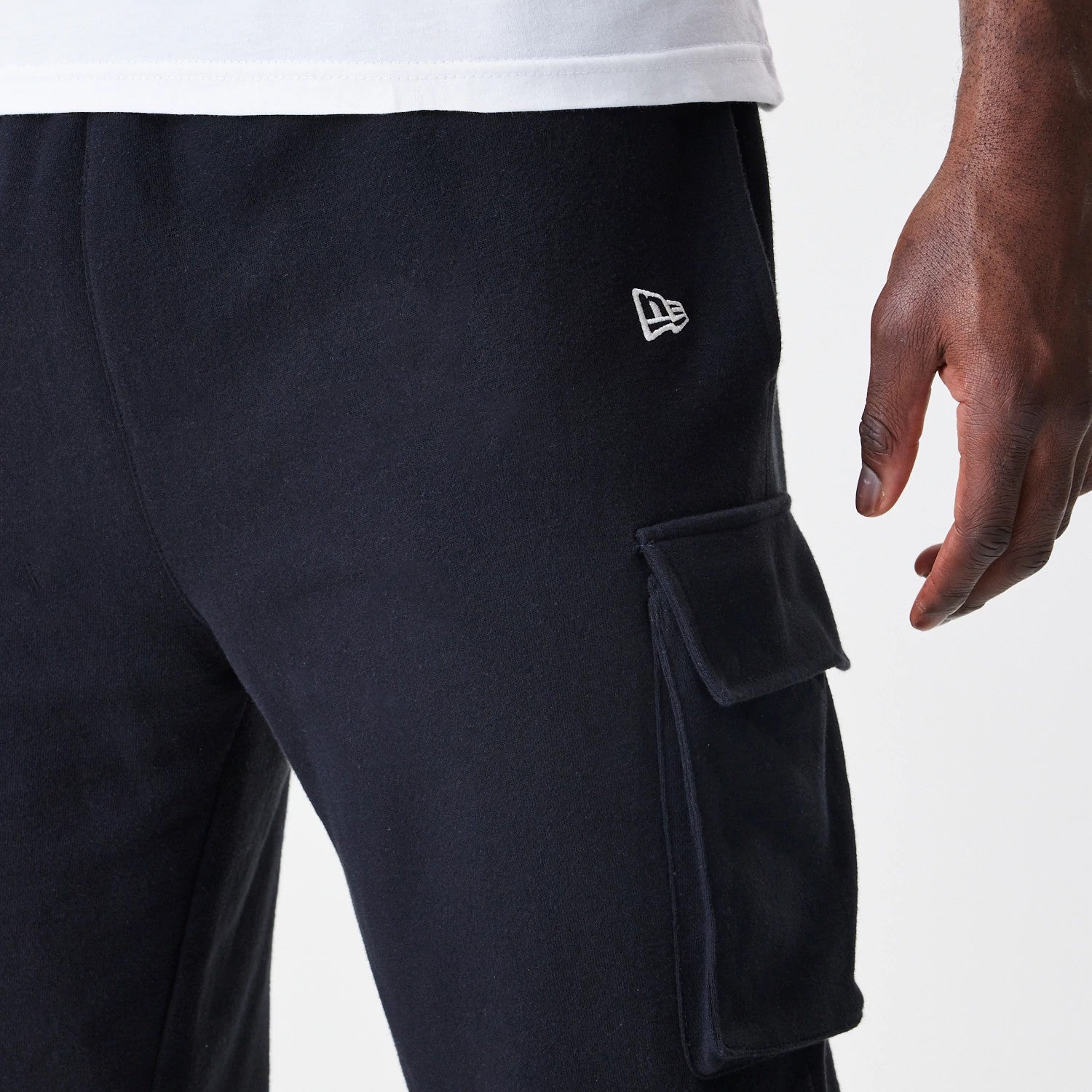The Male model is wearing New Era Cargo Black Joggers 4