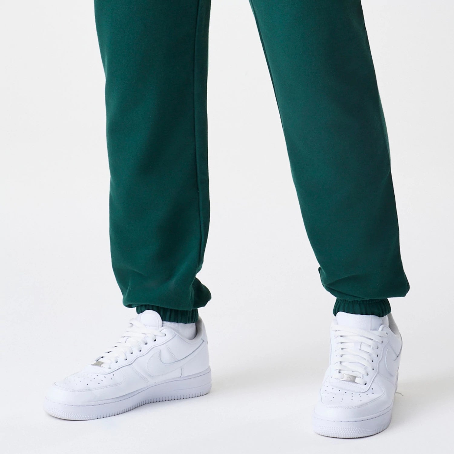 The Male model is wearing New Era Core Cargo Dark Green Joggers 4