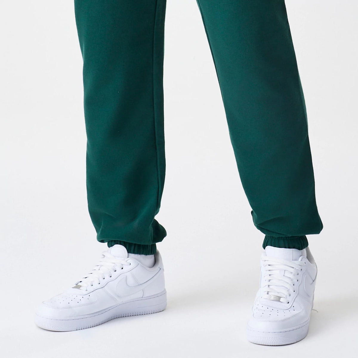 The Male model is wearing New Era Core Cargo Dark Green Joggers 4