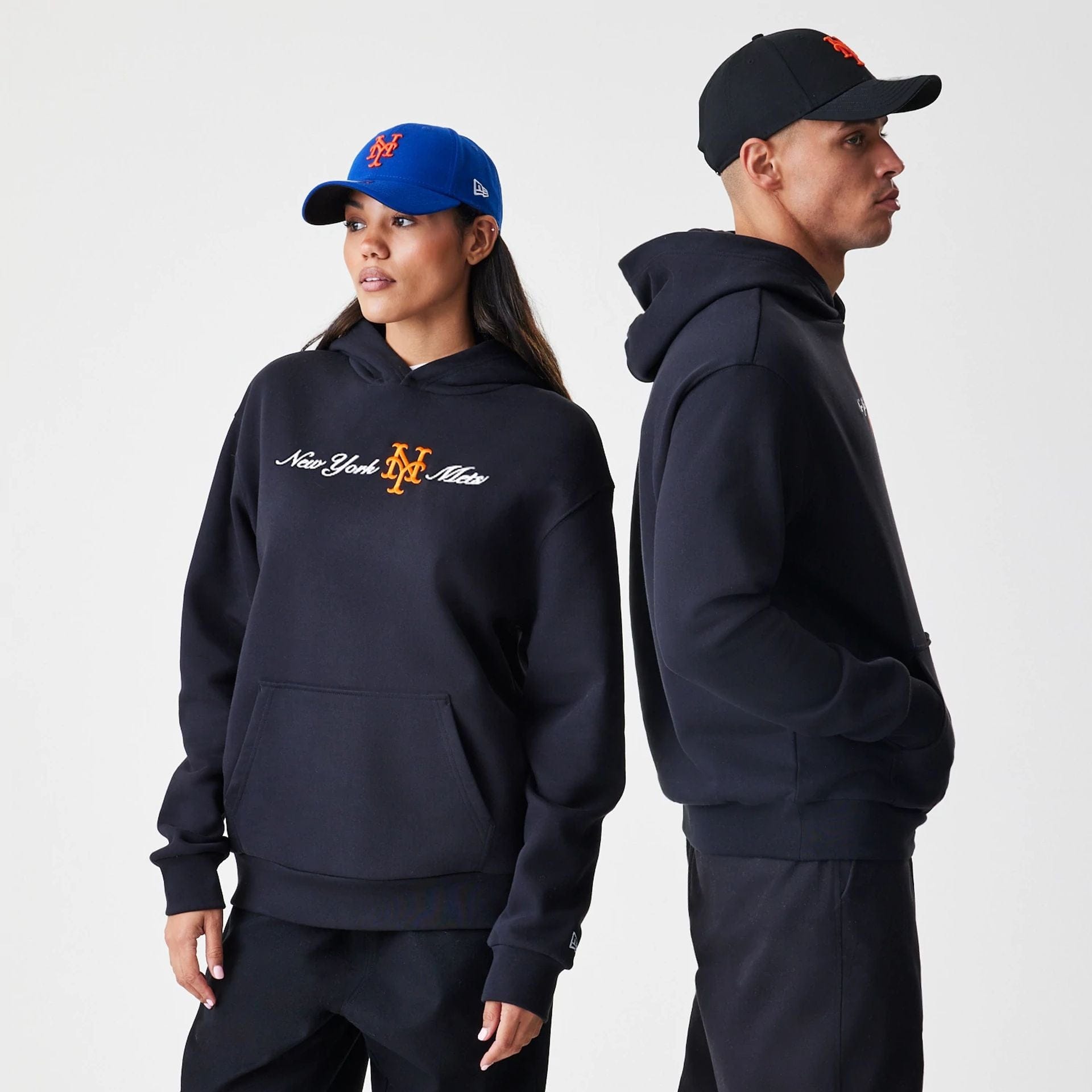 The Male model is wearing New York Mets MLB Script Black Oversized Pullover Hoodie 1