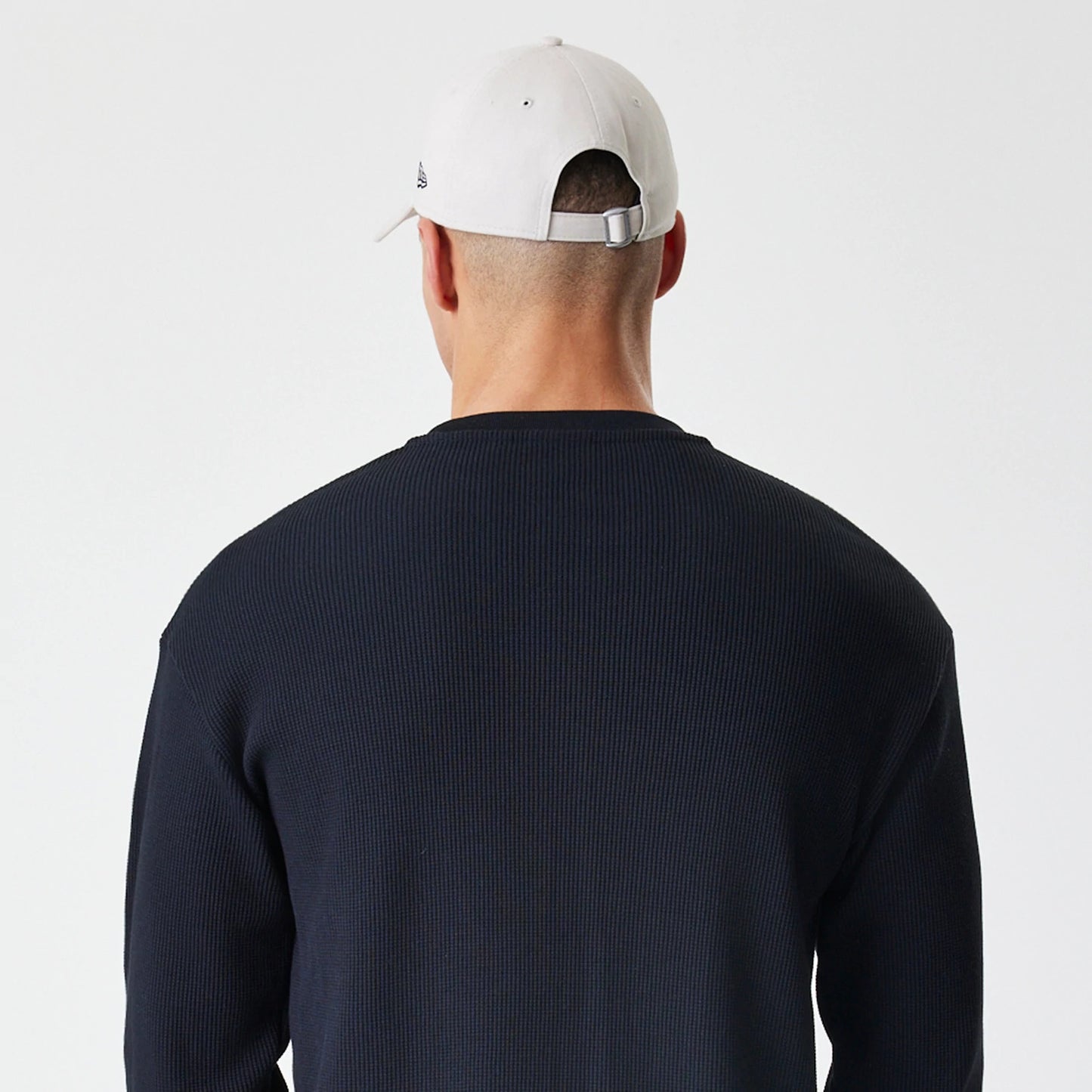 The Male model is wearing New Era Waffle Black Long Sleeve T-Shirt 7
