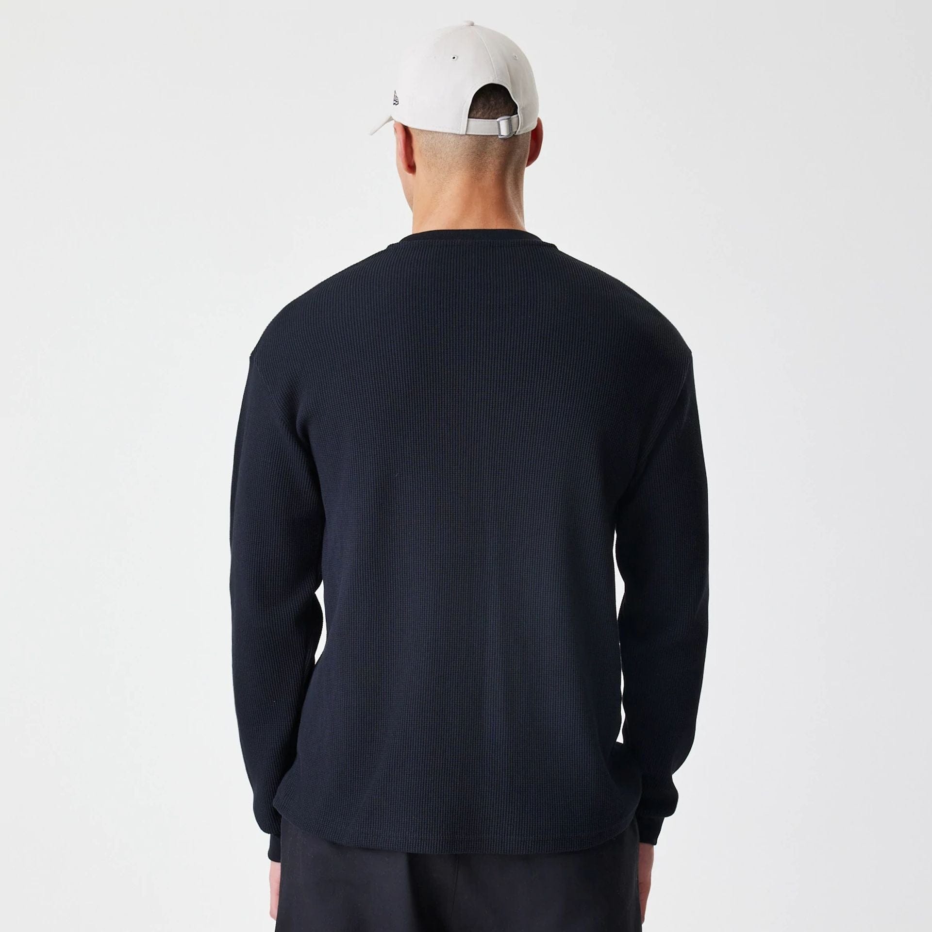 The Male model is wearing New Era Waffle Black Long Sleeve T-Shirt 2