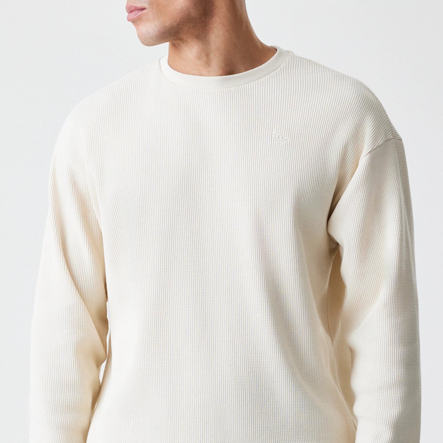 The Male model is wearing New Era Waffle Light Beige Long Sleeve T-Shirt 3