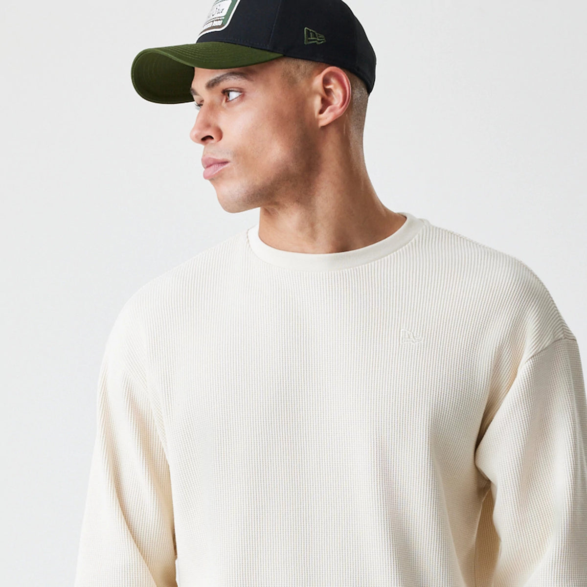 The Male model is wearing New Era Waffle Light Beige Long Sleeve T-Shirt 4
