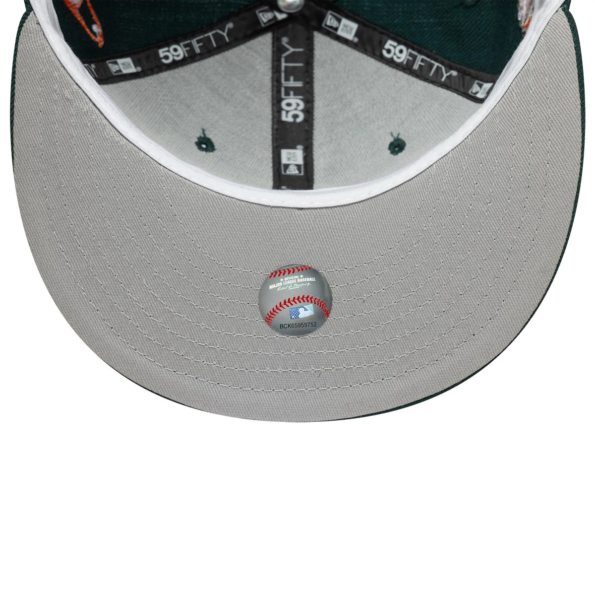Baltimore Orioles MLB Dark Green New Era 59FIFTY Fitted Cap, inside view showing the grey undervisor with an MLB authentication sticker, black 59FIFTY taping, and a white sweatband around the interior.