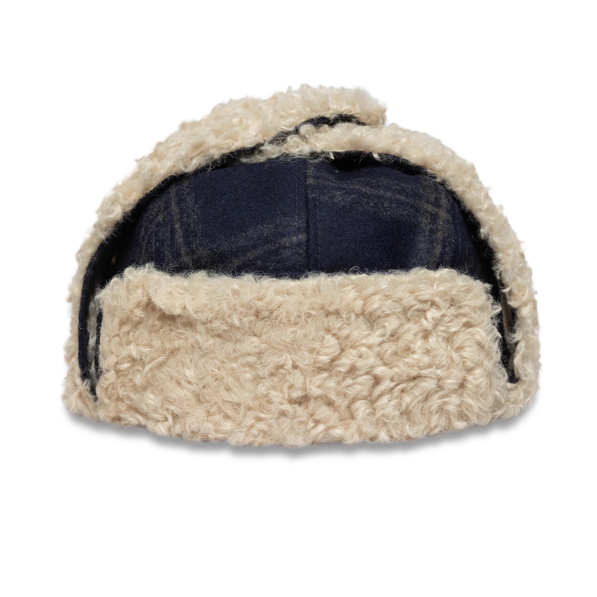 New Era Loden Navy Trapper Hat, rear view showing the thick cream shearling trim folded up at the back with the textured navy crown partially underneath, featuring ear flaps on either side.