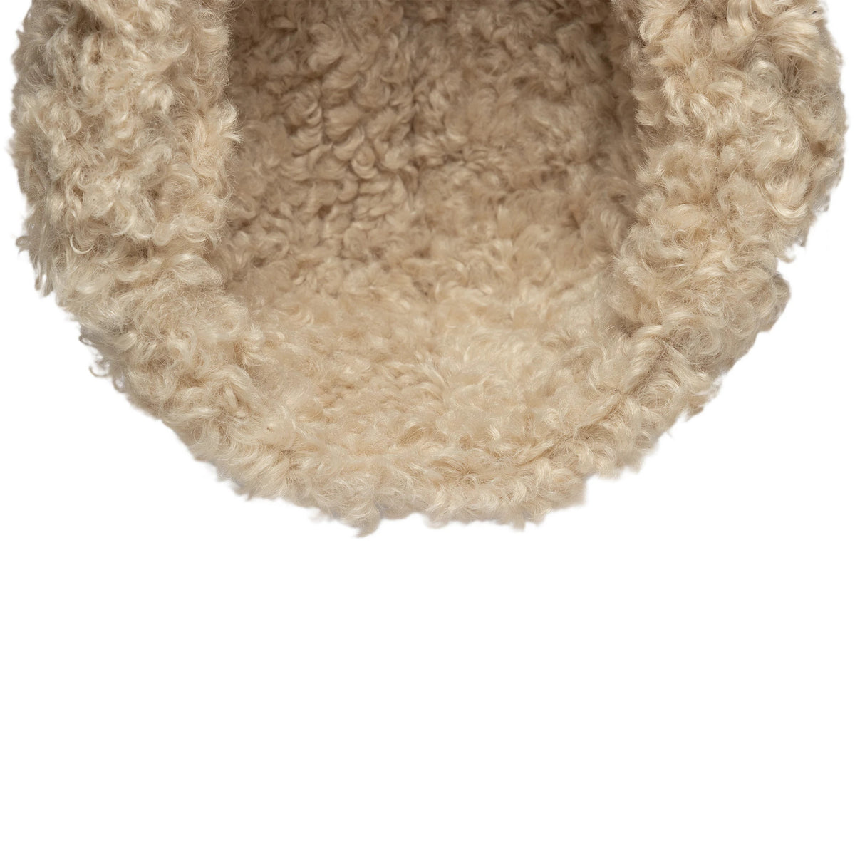 New Era Loden Navy Trapper Hat, inside view showing the soft beige faux fur lining, providing a warm and cosy interior around the edge and throughout the cap, in a close-up of the interior space.