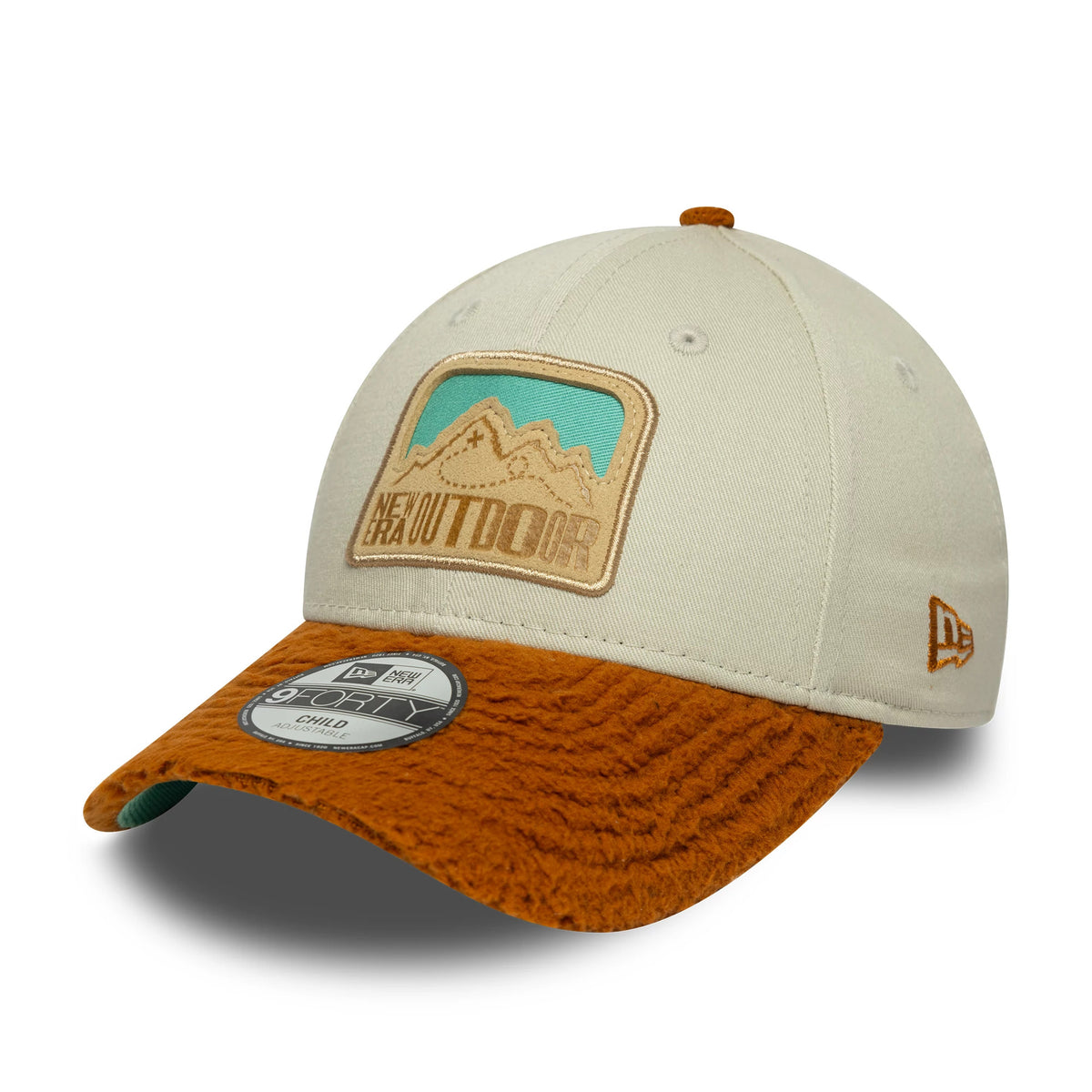 Child New Era Outdoor Cream 9FORTY Adjustable Cap, three-quarter view showing a beige embroidered mountain patch on the cream front panel, brown textured curved visor with a 9FORTY size sticker, and brown New Era flag logo on the left side.