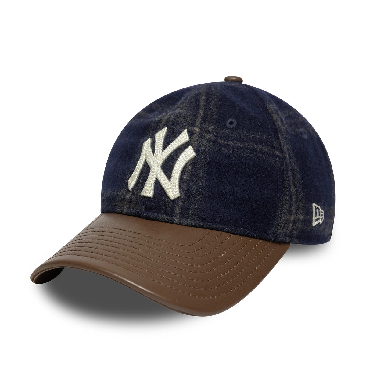 New York Yankees MLB Loden Leather Navy New Era 9TWENTY Adjustable Cap, three-quarter view showing the white raised embroidered NY logo on the front panel, brown leather curved visor, and New Era flag logo on the left side.