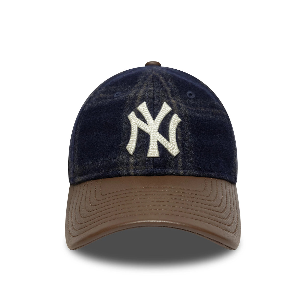 New York Yankees MLB Loden Leather Navy New Era 9TWENTY Adjustable Cap, front view showing the white raised embroidered NY logo on the structured navy crown, with a brown curved leather visor and matching top button.