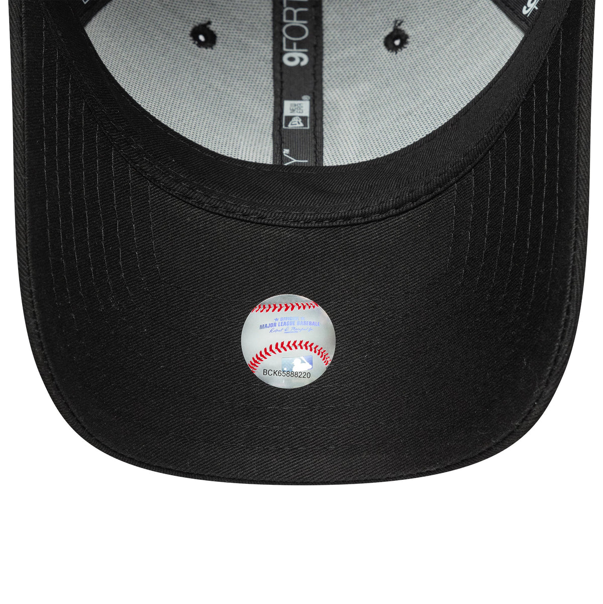 LA Dodgers Womens MLB League Essential Black New Era 9FORTY Adjustable Cap, inside view showing the grey undervisor with black taping, black sweatband, and a baseball design sticker featuring the MLB logo and text at the centre.