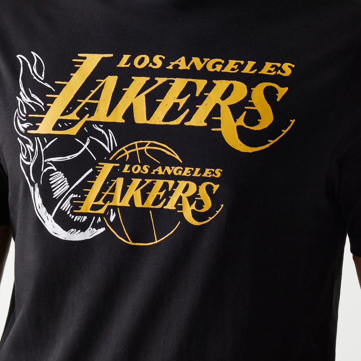 New Era LA Lakers NBA Flame Graphic Black T-Shirt, front view showing yellow Los Angeles Lakers lettering with a basketball graphic, and a white flame motif to the left of the chest on a black background.