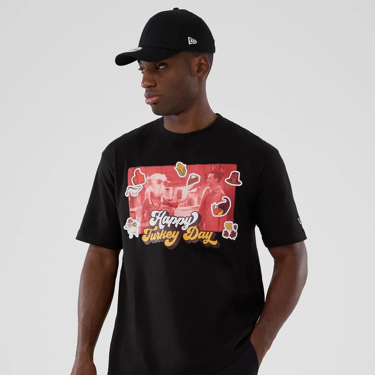 The Male model is wearing Friends Turkey Head Lifestyle Graphic Black T-Shirt 7