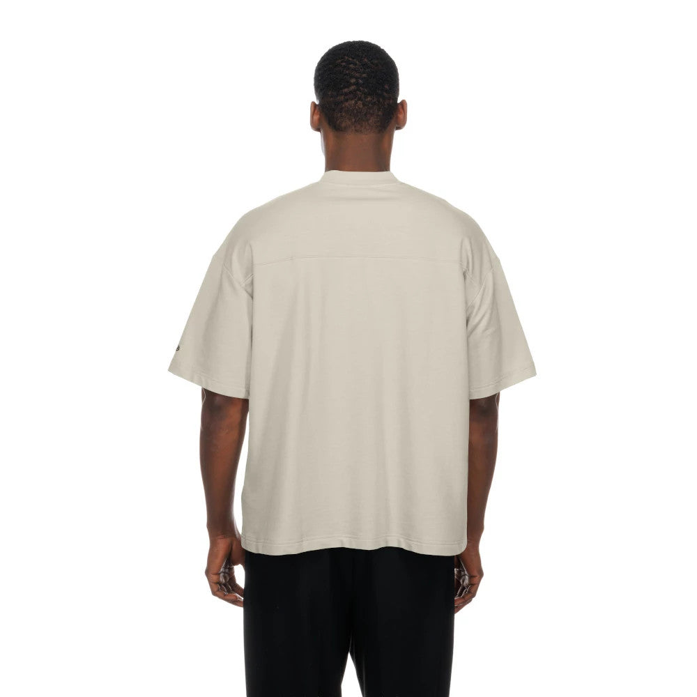 The Male model is wearing New York Knicks NBA Throwback Prep Light Beige T-Shirt 2