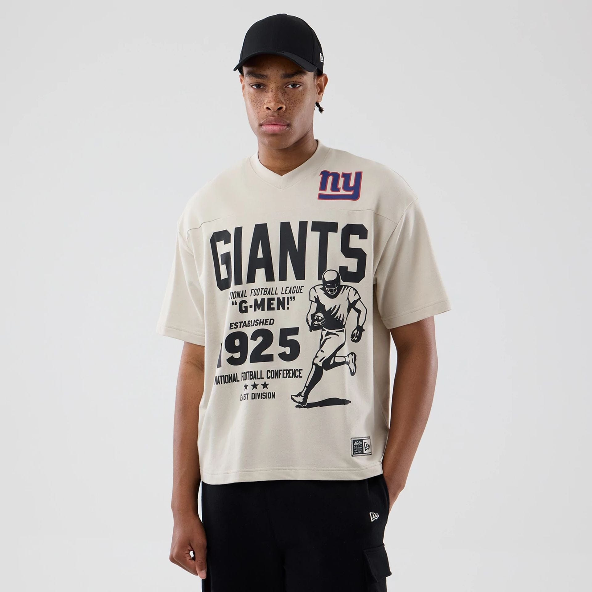 The Male model is wearing New York Giants NFL Throwback Prep Light Beige T-Shirt 1