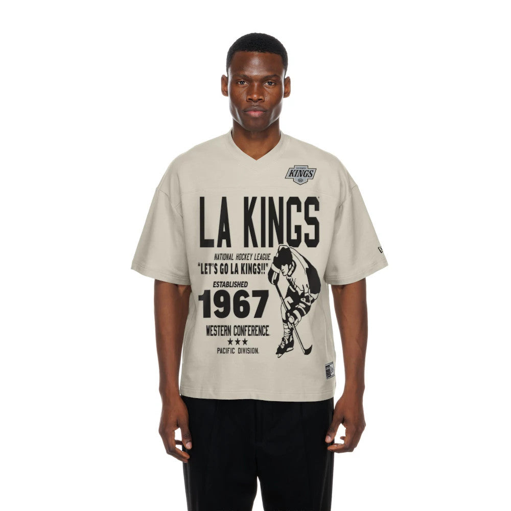 The Male model is wearing LA Kings NHL Throwback Prep Light Beige T-Shirt 1