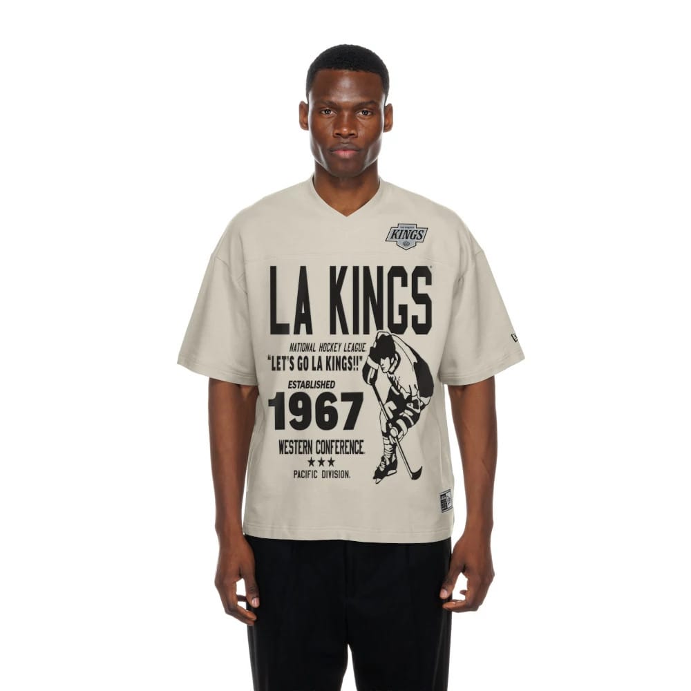 The Male model is wearing LA Kings NHL Throwback Prep Light Beige T-Shirt 1