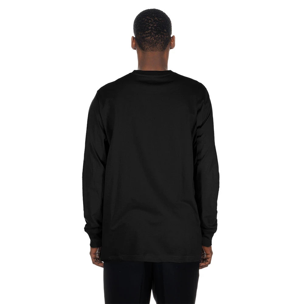 New Era Las Vegas Raiders NFL Sport Classic Black Long Sleeve T-Shirt, back view on a model, showing the plain black fabric extending from the shoulders to the hem, with long sleeves and a simple round neck design.