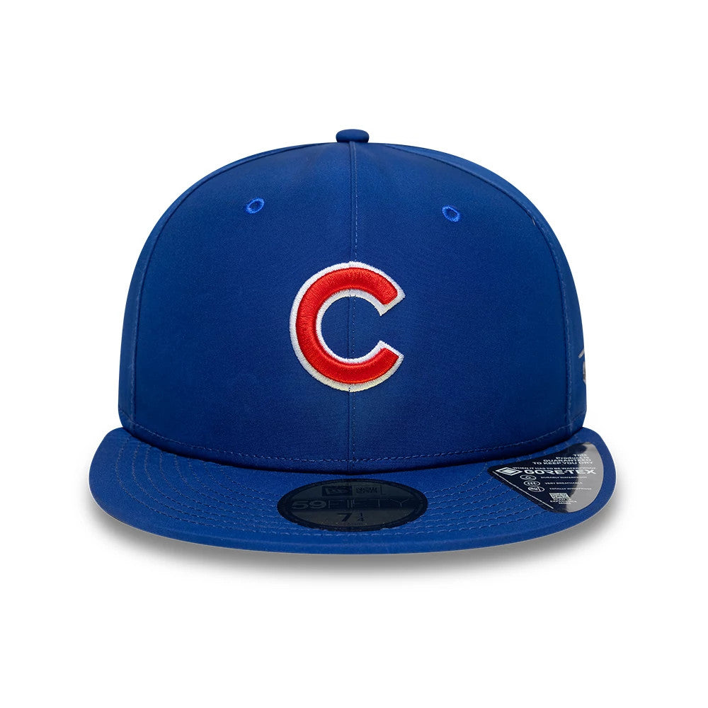 Chicago Cubs MLB Gore-Tex Blue New Era 59FIFTY Fitted Cap, front view showing the raised embroidered red and white Cubs C logo on the front panel with a flat blue visor and a gold 59FIFTY size sticker on the visor.
