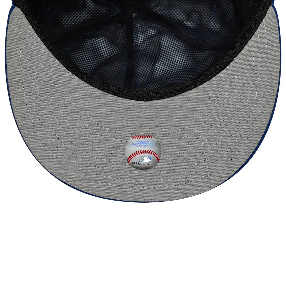 Chicago Cubs MLB Gore-Tex Blue New Era 59FIFTY Fitted Cap, inside view showing the grey undervisor with a baseball-themed sticker, black mesh interior, and black sweatband lining the structured crown.