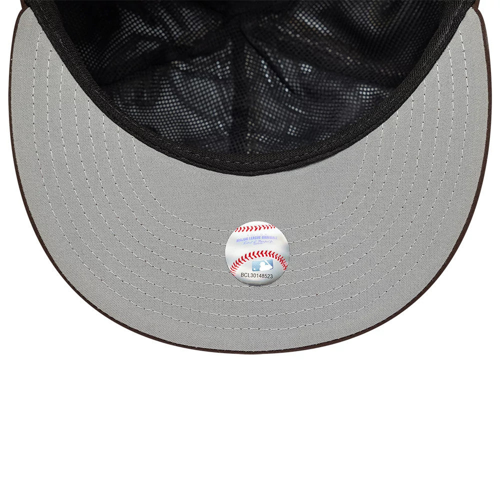 San Diego Padres MLB Gore-Tex Dark Brown New Era 59FIFTY Fitted Cap, inside view showing the grey undervisor with a baseball sticker, black sweatband and patterned interior taping on the structured crown.