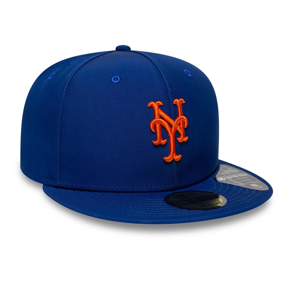 New York Mets MLB Gore-Tex Blue New Era 59FIFTY Fitted Cap, front view showing the orange NY logo in raised embroidery on the structured blue crown, complemented by a blue flat visor with a gold 59FIFTY size sticker.