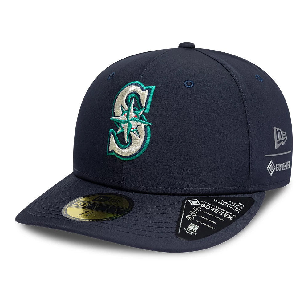 Seattle Mariners MLB Gore-Tex Navy New Era 59FIFTY Fitted Cap, three-quarter view showing a raised teal and white S logo with compass on the front panel, navy flat visor with gold 59FIFTY size sticker and Gore-Tex branding on the side.
