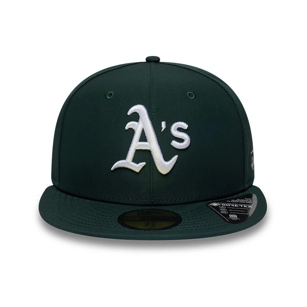 Athletics MLB Gore-Tex Dark Green New Era 59FIFTY Fitted Cap, front view showing the white raised embroidered A’s logo on the structured dark green crown, with a flat visor and gold 59FIFTY size sticker on top.