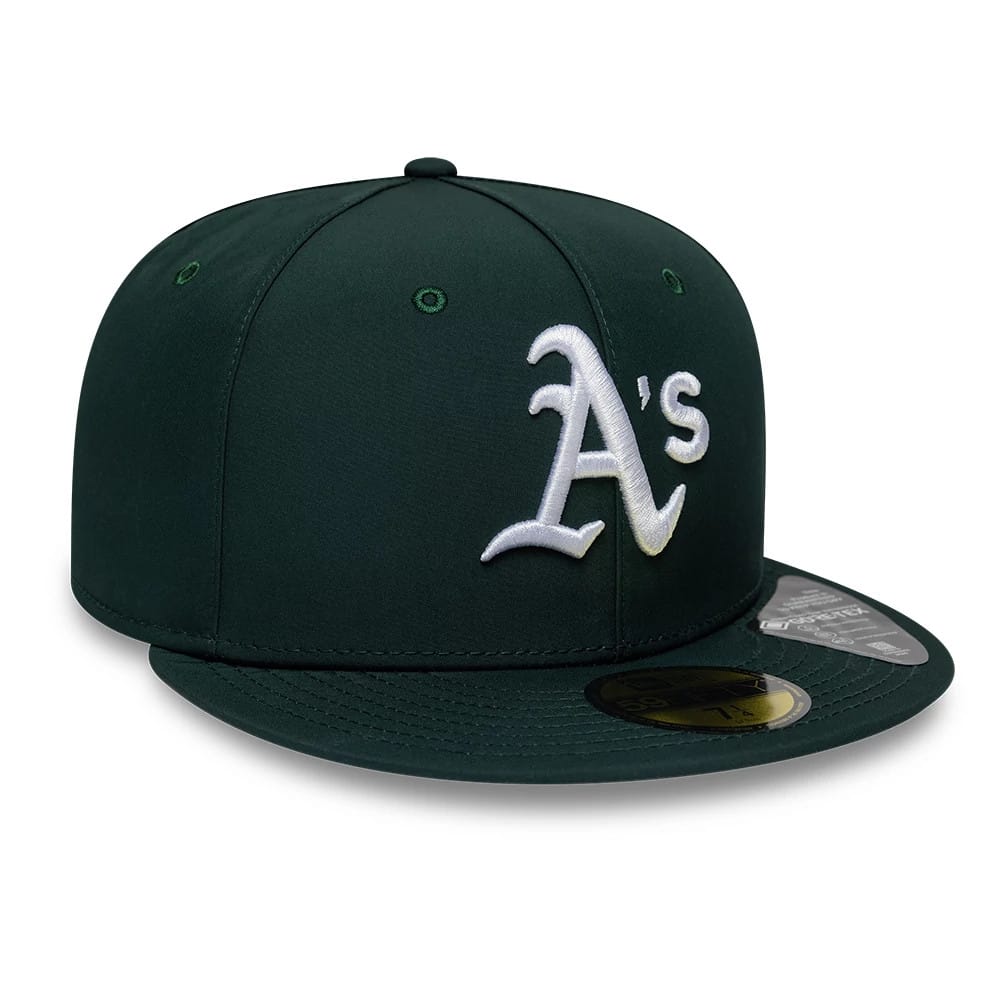 Athletics MLB Gore-Tex Dark Green New Era 59FIFTY Fitted Cap, front view showing the white raised embroidered A's logo on the structured dark green crown, with a flat dark green visor and a gold 59FIFTY size sticker.