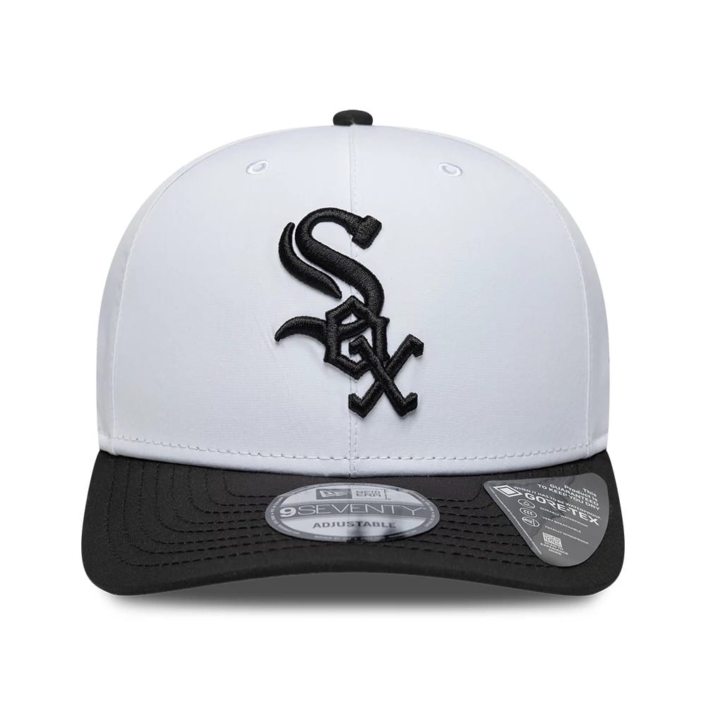 Chicago White Sox MLB Gore-Tex White New Era 9SEVENTY Stretch Snap Adjustable Cap, front view showing the black Sox logo in raised embroidery on the white crown, with a black curved visor and a 9SEVENTY size sticker.