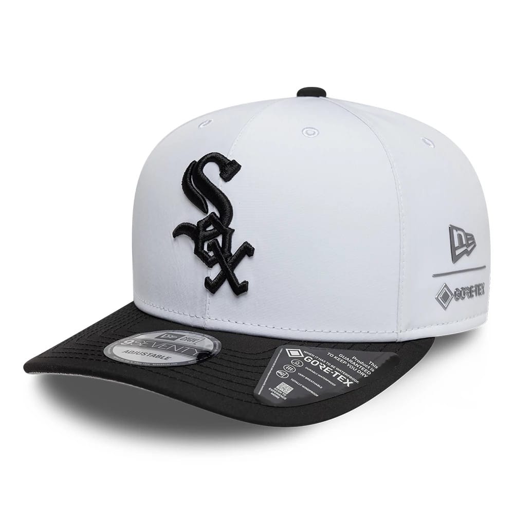 Chicago White Sox MLB Gore-Tex White New Era 9SEVENTY Stretch Snap Adjustable Cap, three-quarter view showing raised black Sox logo on the white front panel, black curved visor with a 9SEVENTY size sticker and Gore-Tex branding on the right side.