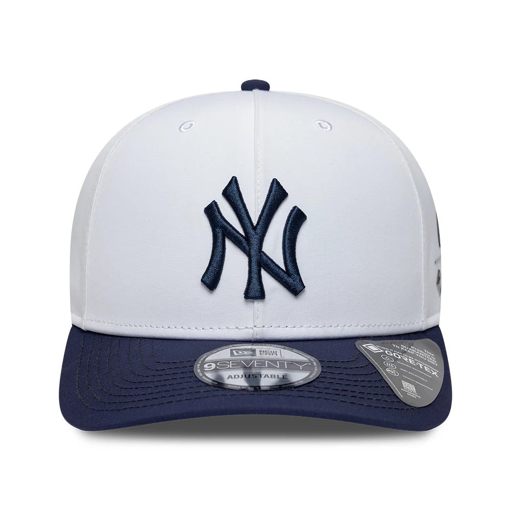 New York Yankees MLB Gore-Tex White New Era 9SEVENTY Stretch Snap Adjustable Cap, front view showing a navy embroidered Yankees logo on the white front panel, a navy visor with a 9SEVENTY size sticker, and small Gore-Tex label on the side.