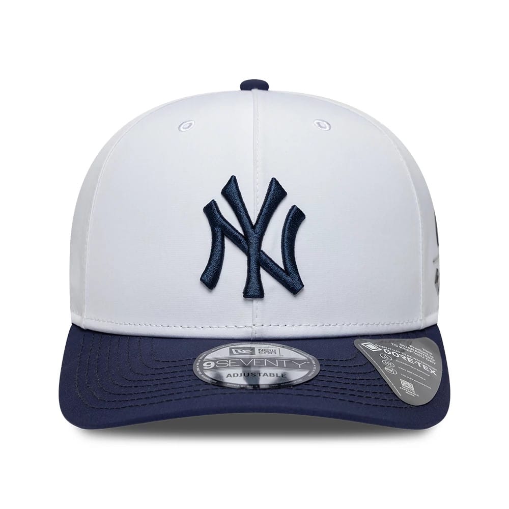 New York Yankees MLB Gore-Tex White New Era 9SEVENTY Stretch Snap Adjustable Cap, front view showing a navy embroidered Yankees logo on the white front panel, a navy visor with a 9SEVENTY size sticker, and small Gore-Tex label on the side.
